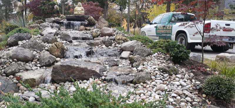 Natural Impressions truck on-site next to a completed fountain installation
